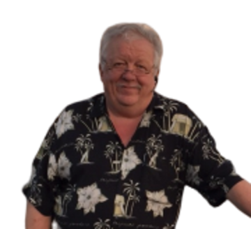 Bjarne “Conrad” Conradsen, smiling, in a palm-print shirt